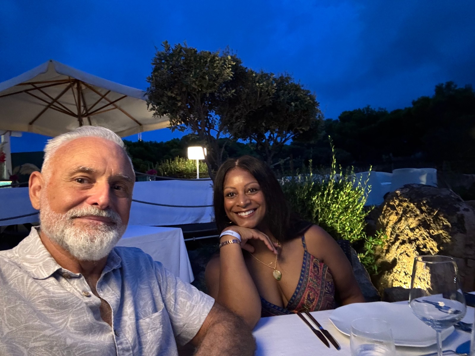 Carlo and Jeia Lauria at dinner on Sicily's northern coast at dusk